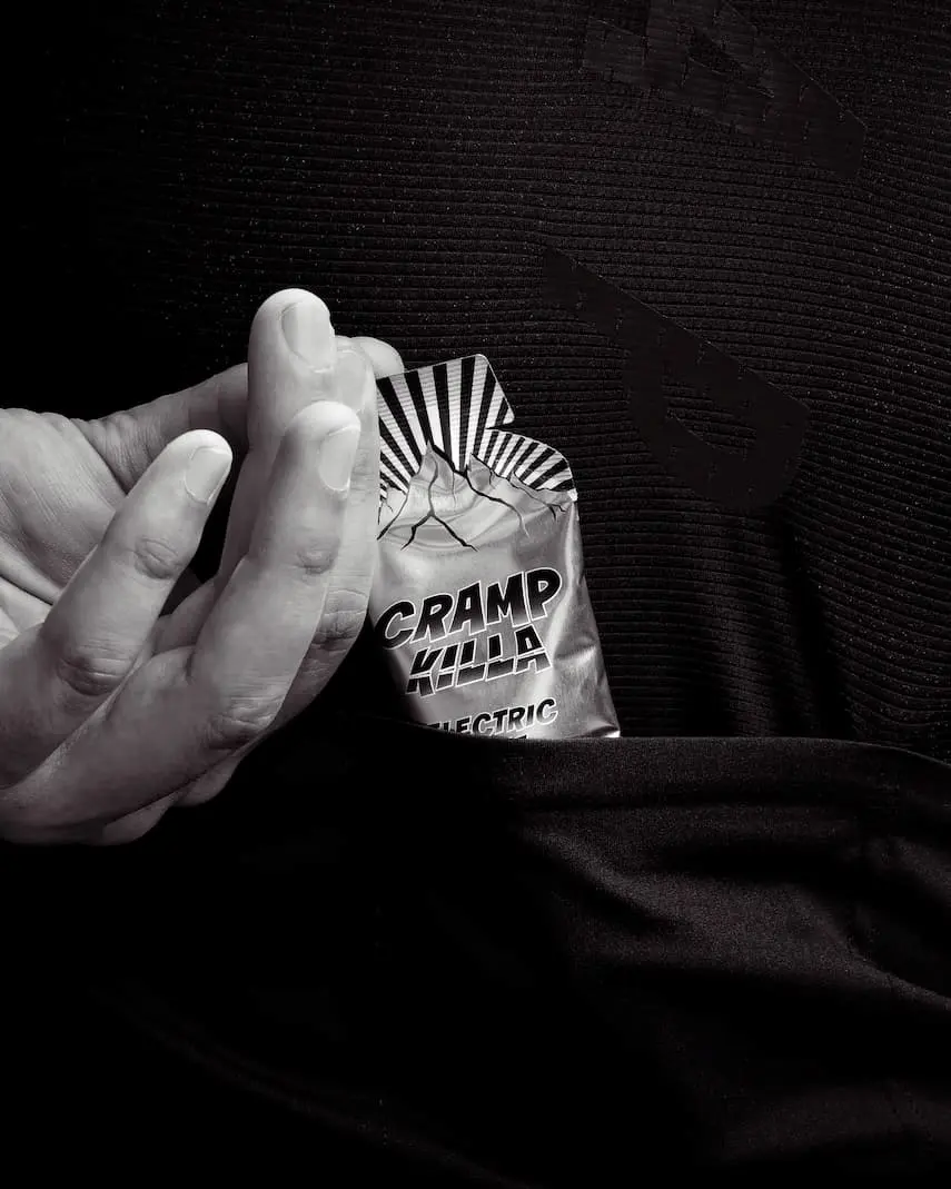 Cramp Killa sachet in an athlete's pocket